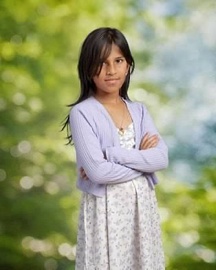 Student standing confidently with folded arms